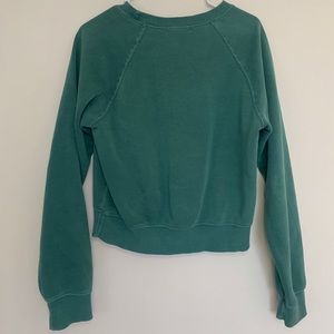 small green sweater